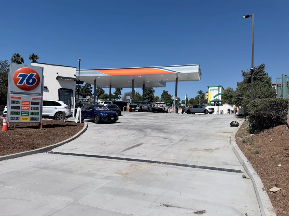 The 76-branded fuel station and entrance at Magic Mart on 54th Street